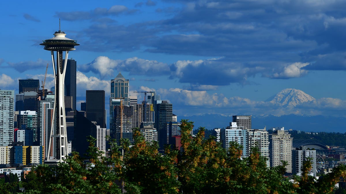 Seattle Space Needle and downtown skyline with Mount Rainier in the background